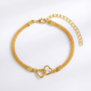 Gold double heart mesh anklet laid flat with extender on white