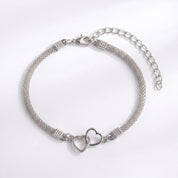 Silver double heart mesh anklet laid flat with extender on white