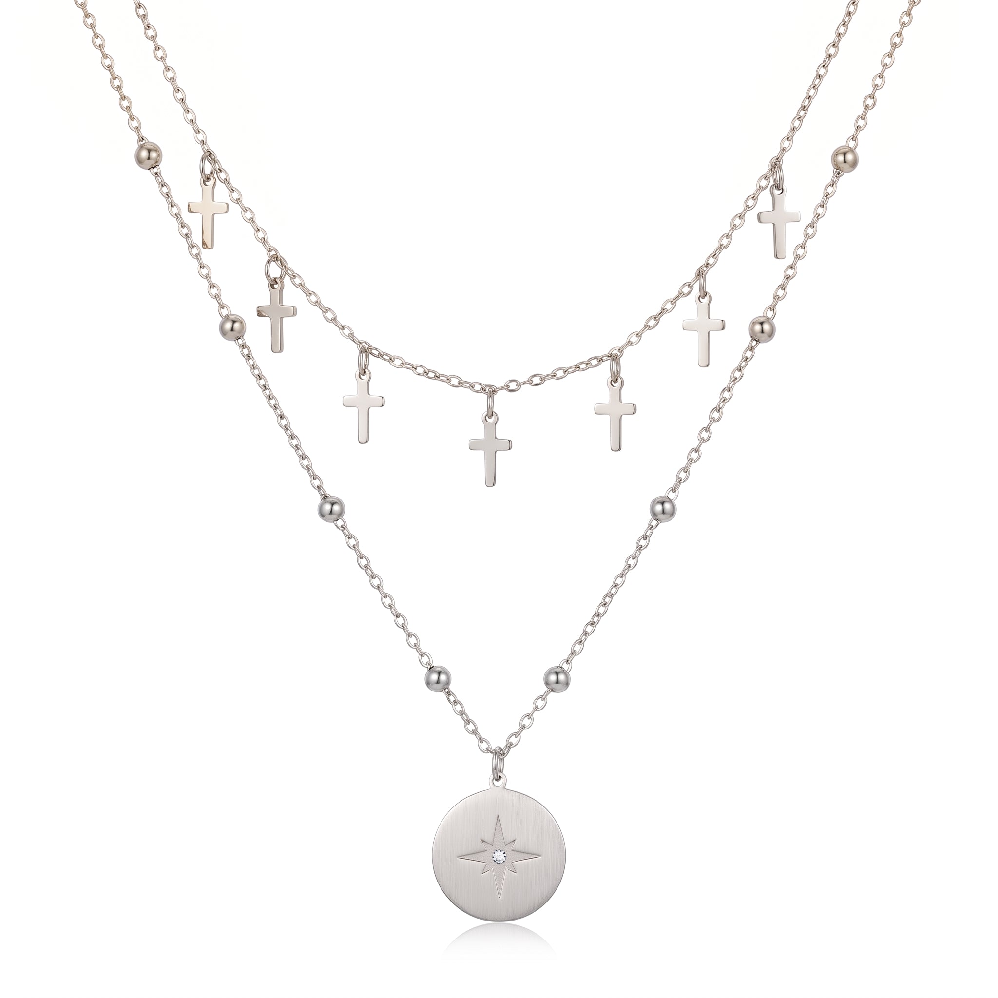 Silver cross charm chain and north star medallion on a beaded chain, white background