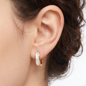 Gold square huggie earring with mother of pearl inlay, close-up