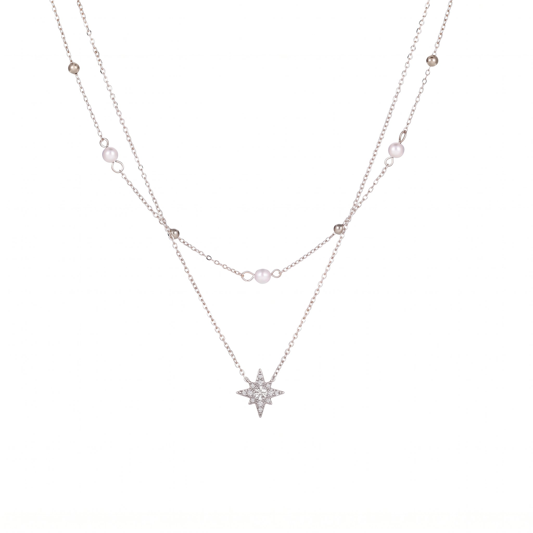 Silver pearl and bead chain with a crystal-set north star on white background