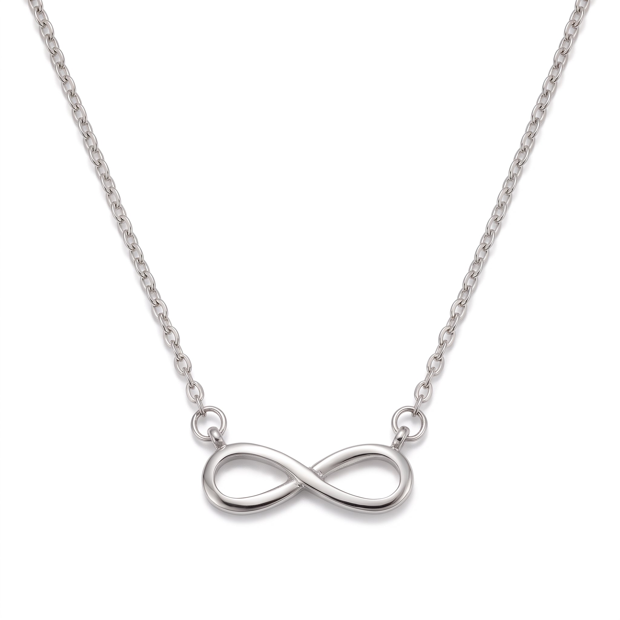 Silver infinity necklace laid out on a white background