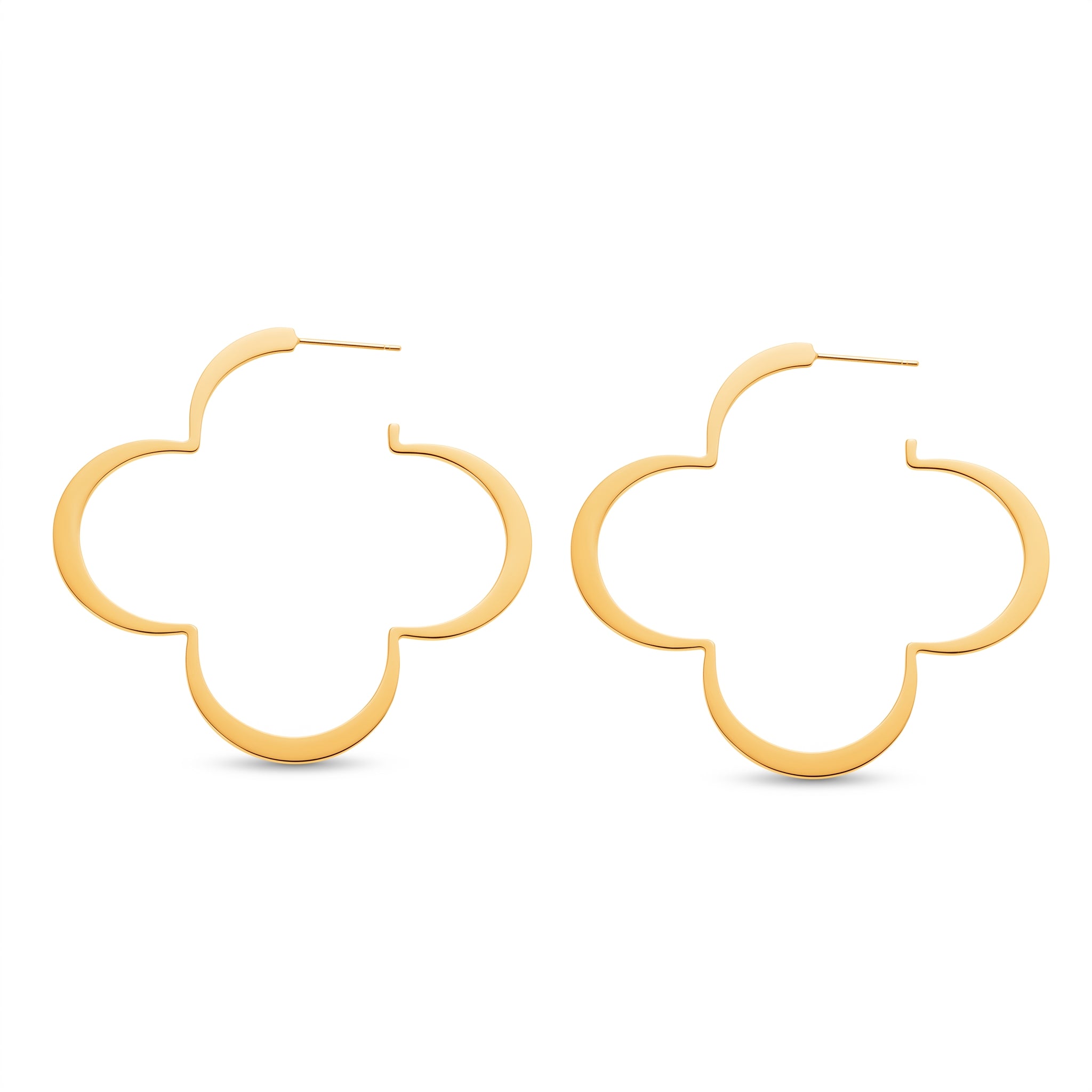 Pair of gold four leaf clover hoop earrings on white