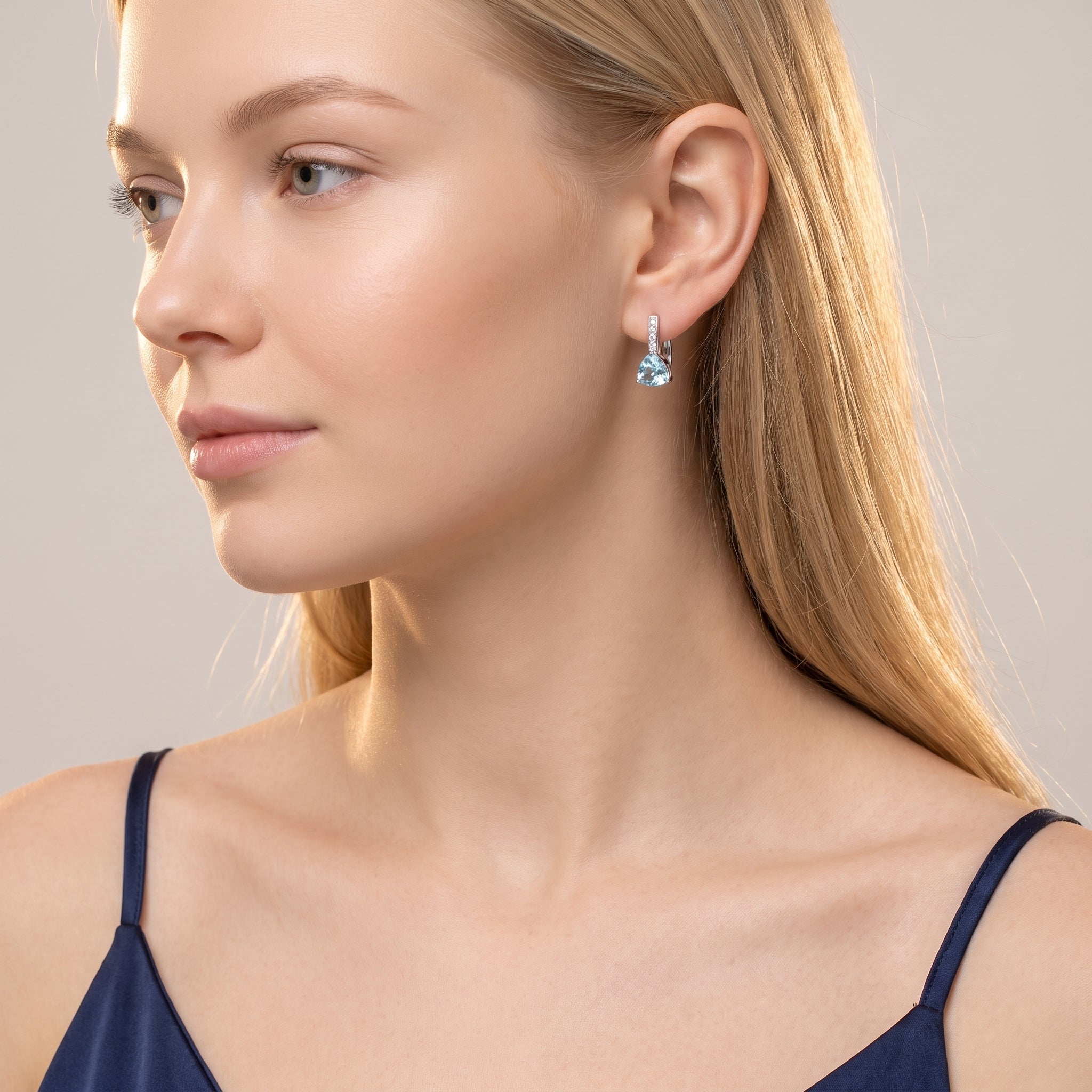 Silver blue crystal drop earrings worn with a navy camisole