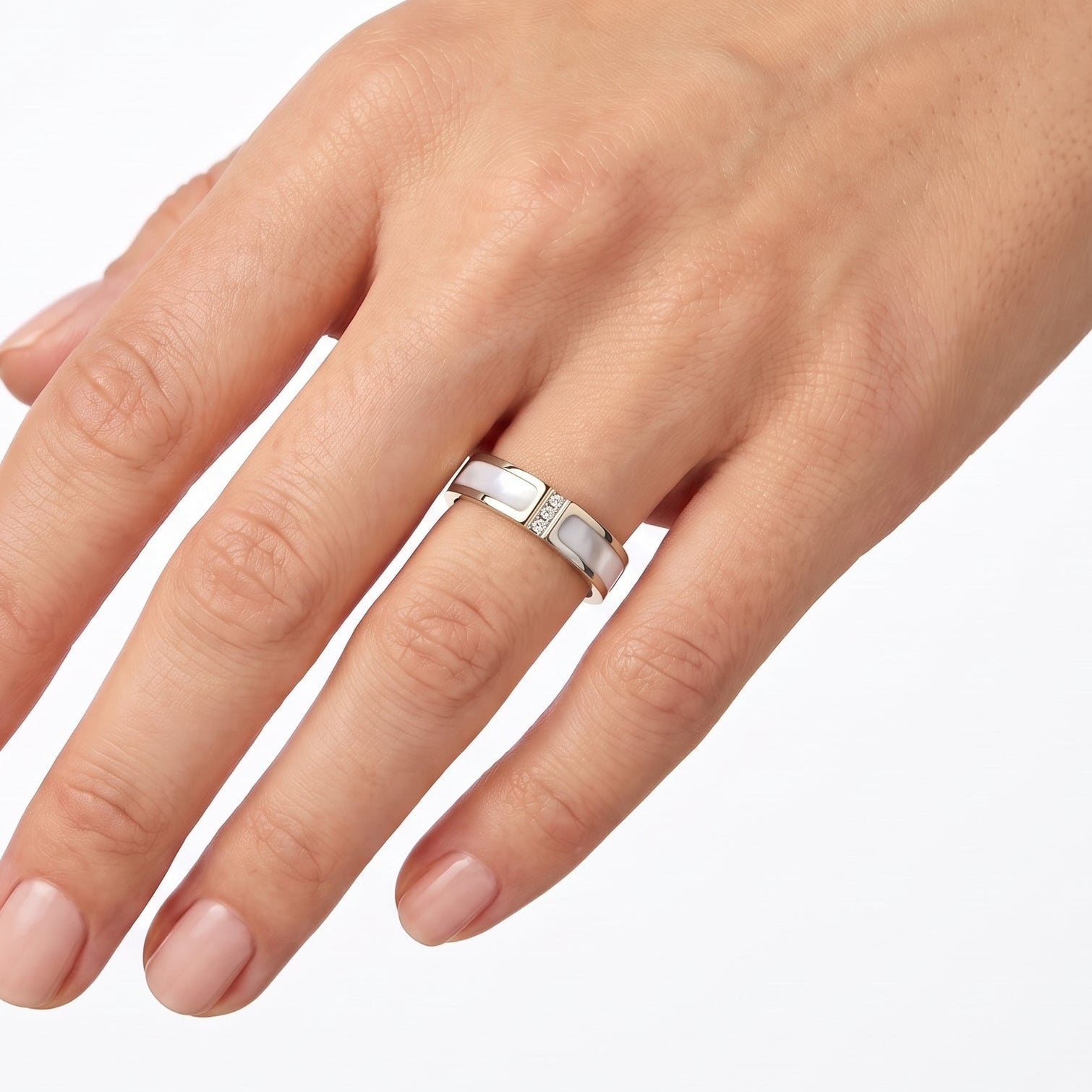 Silver mother of pearl band ring with crystals worn on the hand