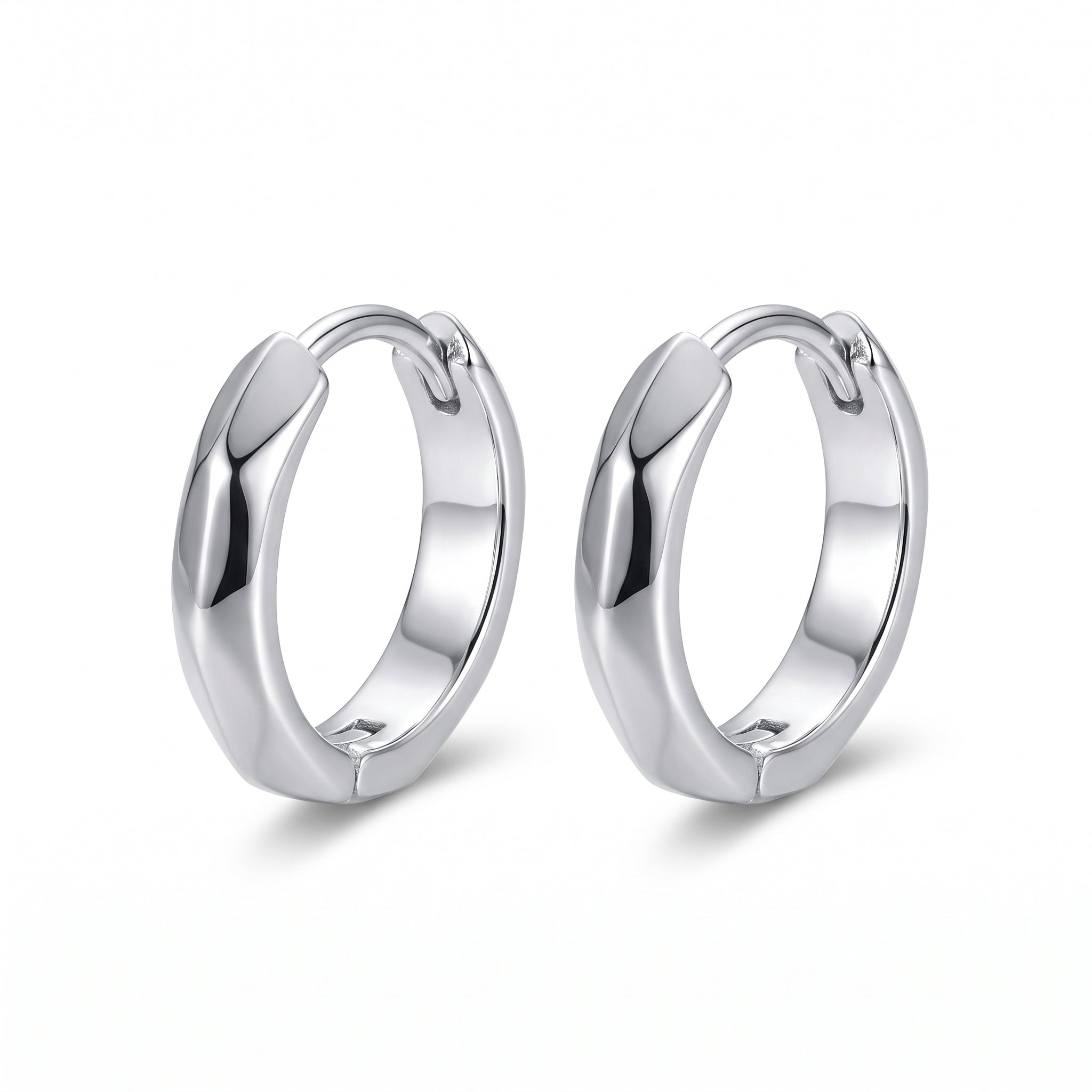 Silver faceted huggie hoops side by side on white