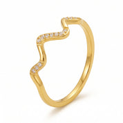Gold wave ring on white showing the grouped crystals