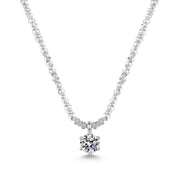 Close-up of the silver solitaire necklace's six-prong crystal on white