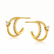 Pair of gold double hoop earrings with crystals on white