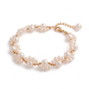 Gold pearl cluster bracelet with pearl drop on white