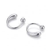 Silver open teardrop hoop earrings with ball ends on white