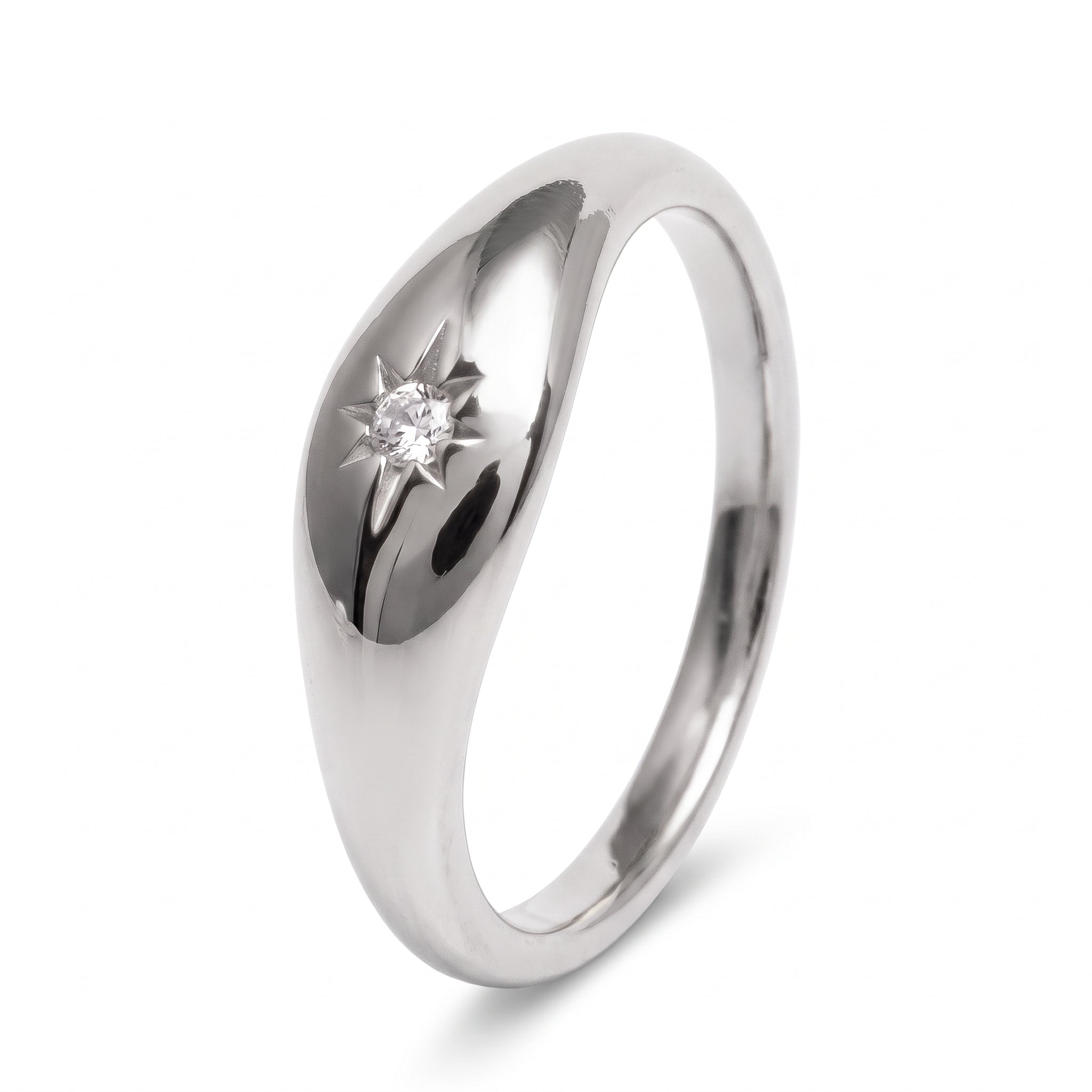 Silver star signet ring on white showing the domed top