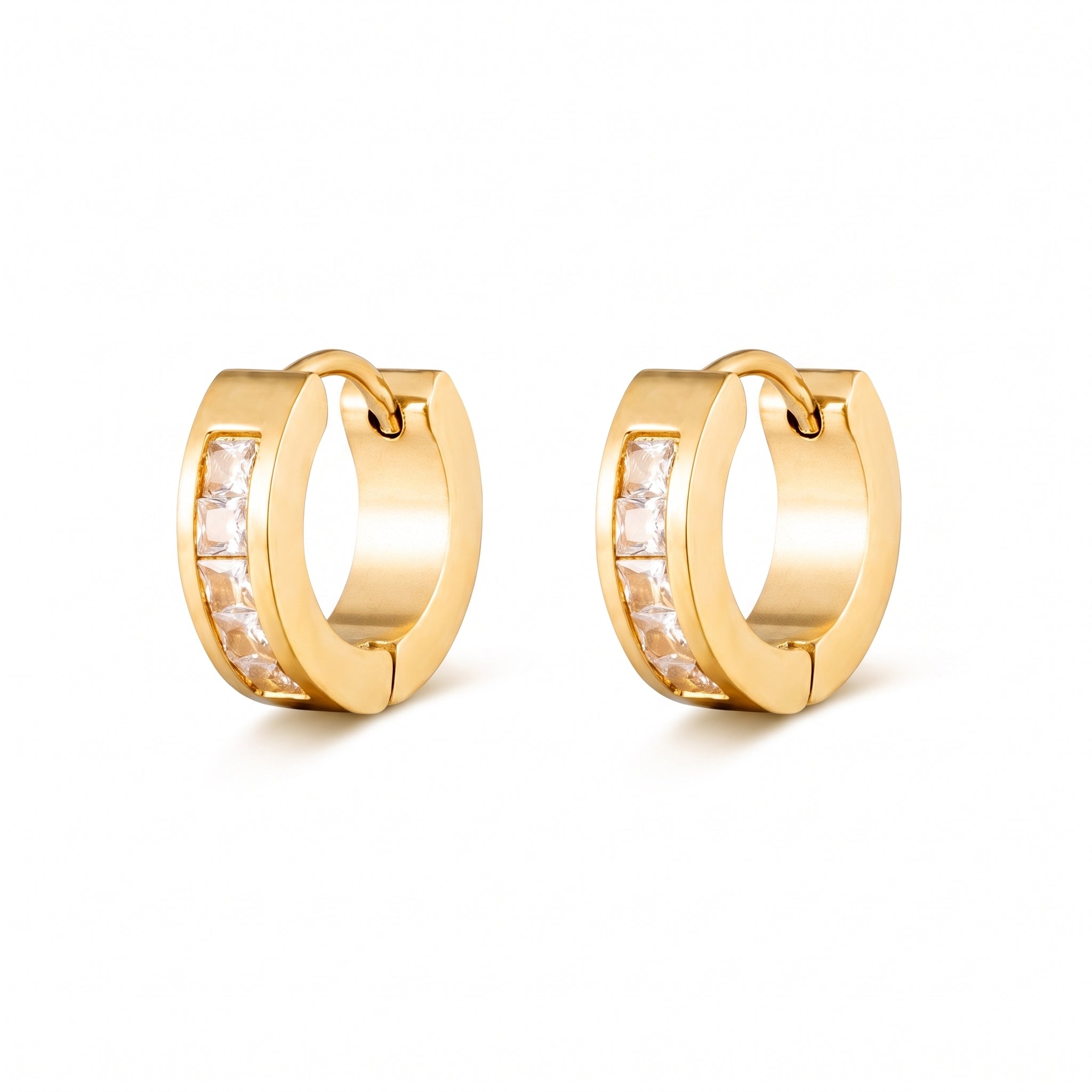 Pair of Maelle gold huggie earrings with square-cut crystals on white background