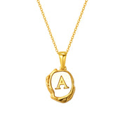 Gold initial necklace with letter A on a mother of pearl pendant