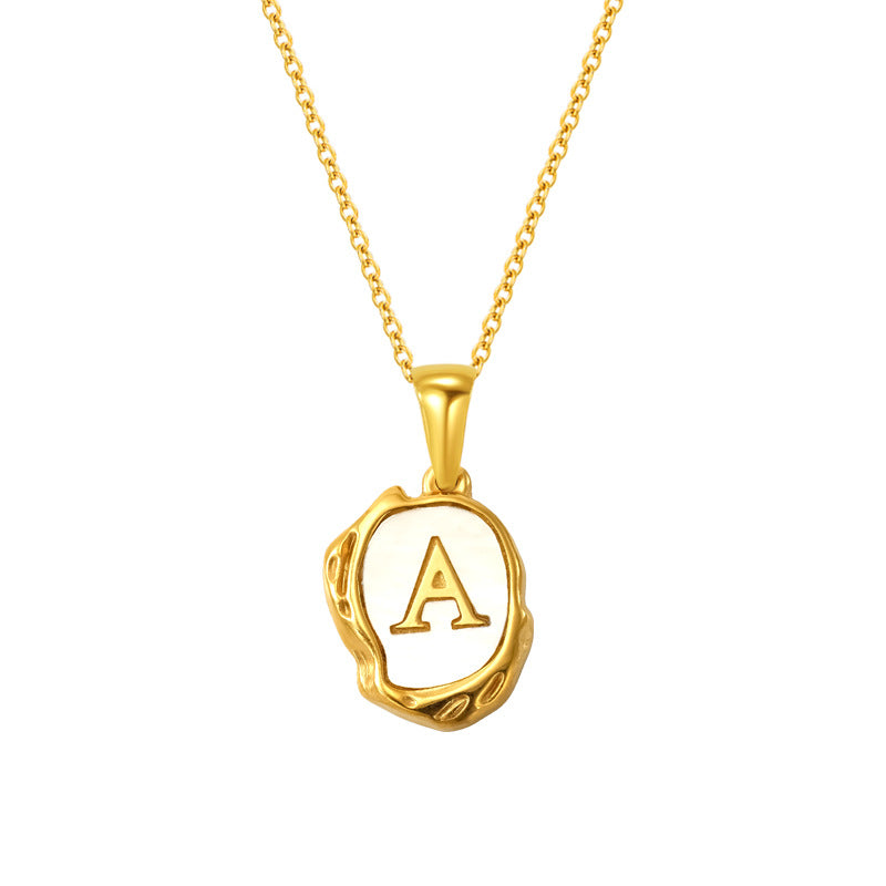 Gold initial necklace with letter A on a mother of pearl pendant