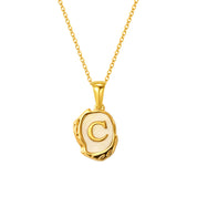 Maelle gold initial necklace, letter C on mother of pearl