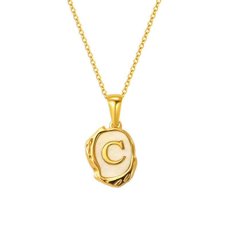 Maelle gold initial necklace, letter C on mother of pearl