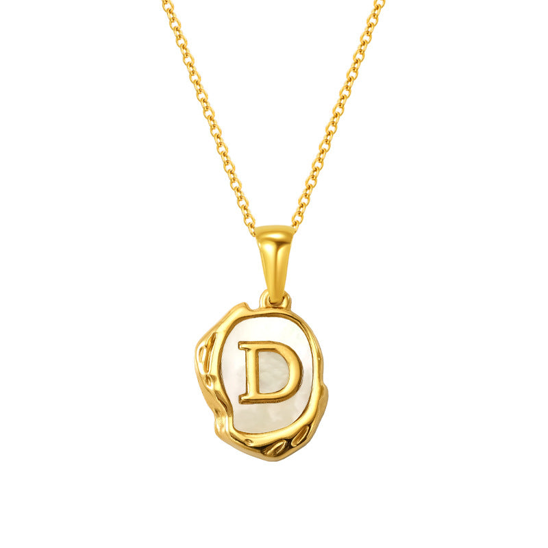 Maelle gold initial necklace, letter D on mother of pearl