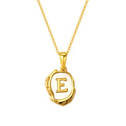 Maelle gold initial necklace, letter E on mother of pearl