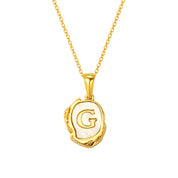 Maelle gold initial necklace, letter G on mother of pearl