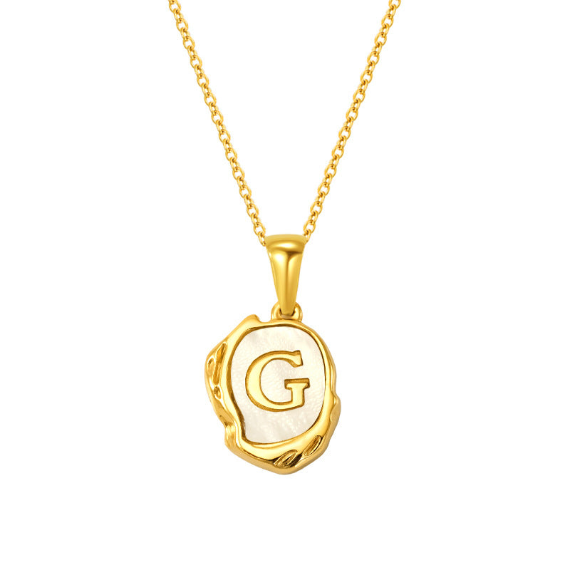 Maelle gold initial necklace, letter G on mother of pearl
