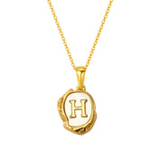Maelle gold initial necklace, letter H on mother of pearl