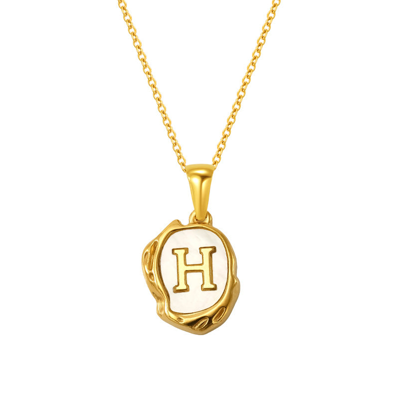 Maelle gold initial necklace, letter H on mother of pearl