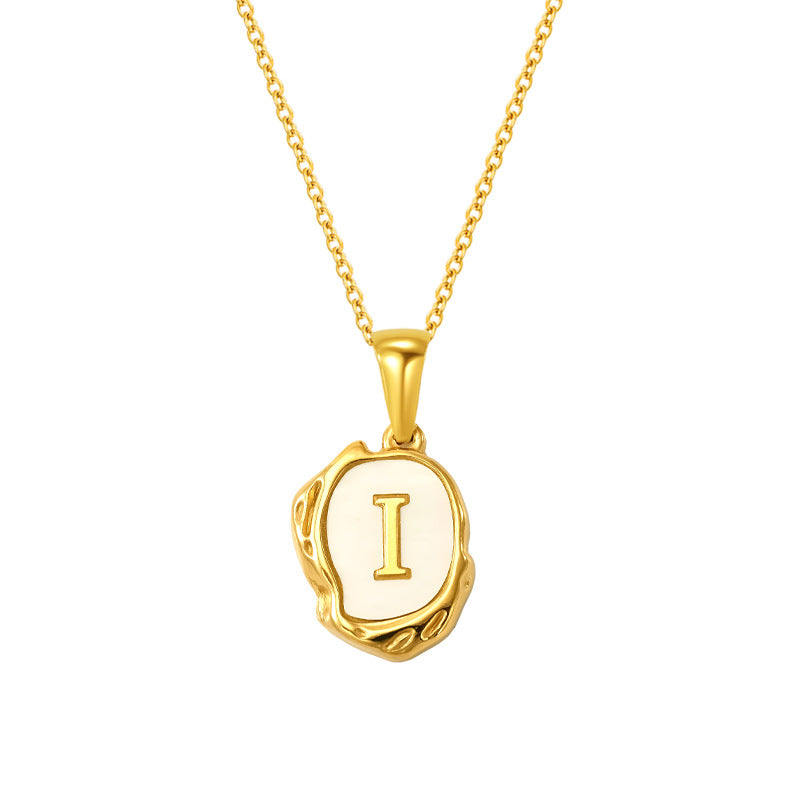 Maelle gold initial necklace, letter I on mother of pearl