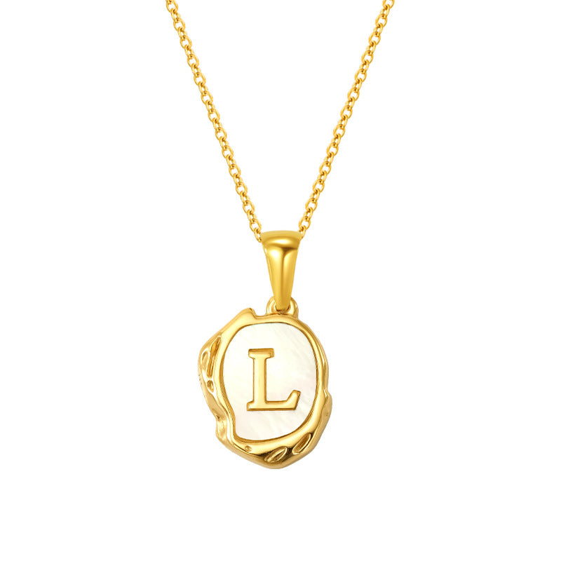 Maelle gold initial necklace, letter L on mother of pearl
