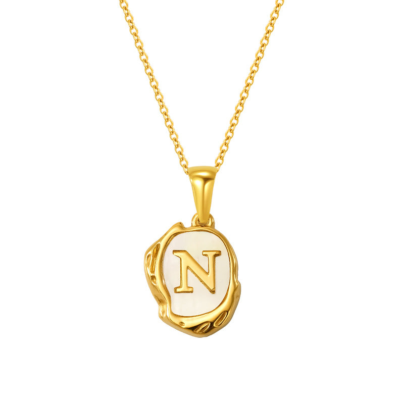 Maelle gold initial necklace, letter N on mother of pearl