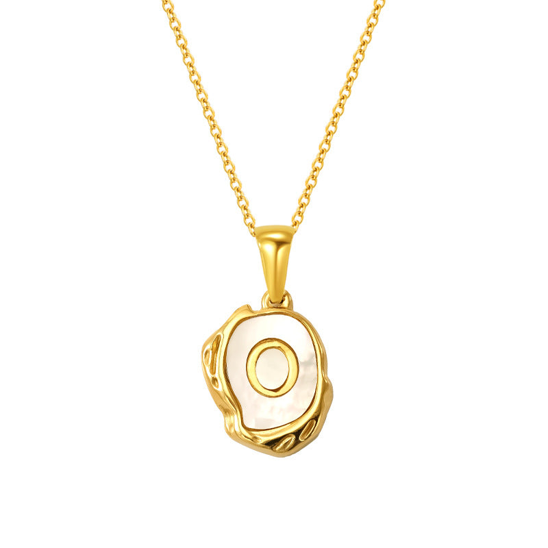 Maelle gold initial necklace, letter O on mother of pearl