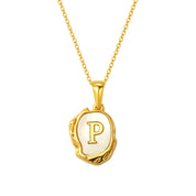 Maelle gold initial necklace, letter P on mother of pearl
