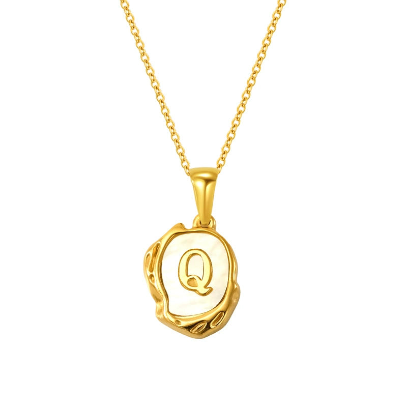 Maelle gold initial necklace, letter Q on mother of pearl