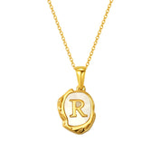 Maelle gold initial necklace, letter R on mother of pearl