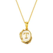 Maelle gold initial necklace, letter T on mother of pearl