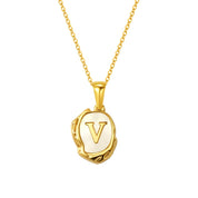 Maelle gold initial necklace, letter V on mother of pearl