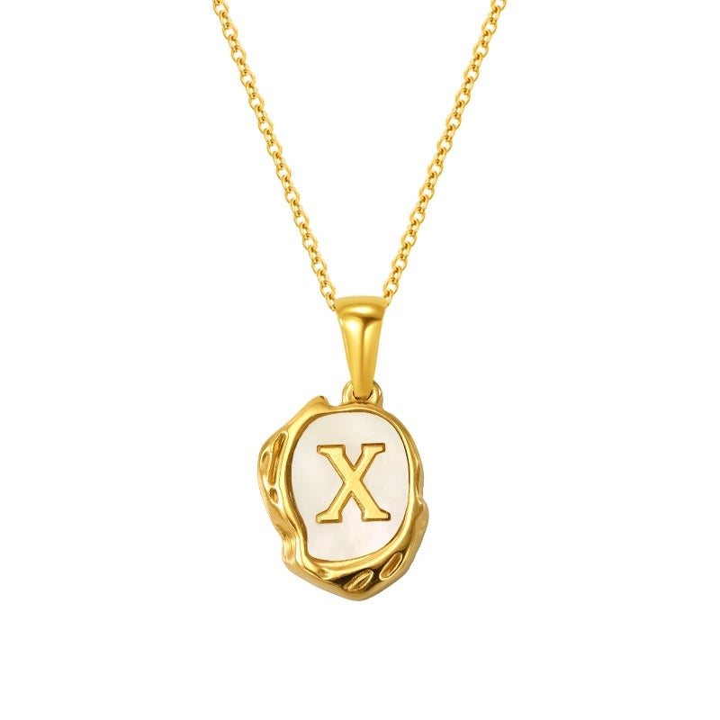 Maelle gold initial necklace, letter X on mother of pearl
