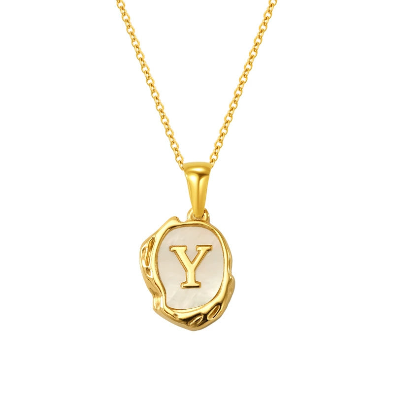Maelle gold initial necklace, letter Y on mother of pearl