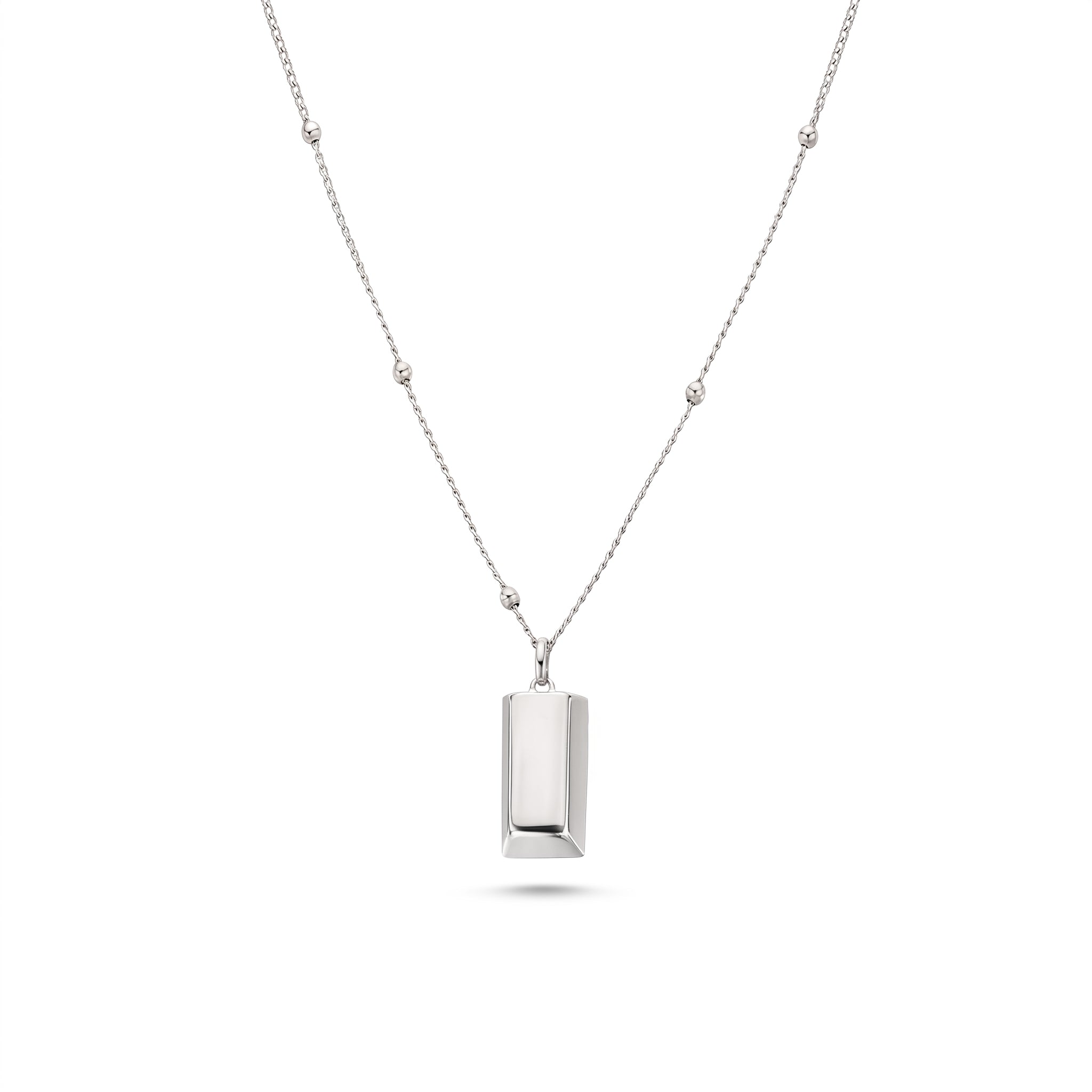 Silver bar necklace laid flat on white, beaded satellite chain