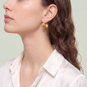 Gold spiral hoop earring in a sculpted side profile