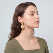 Gold cream resin drop earring in side profile
