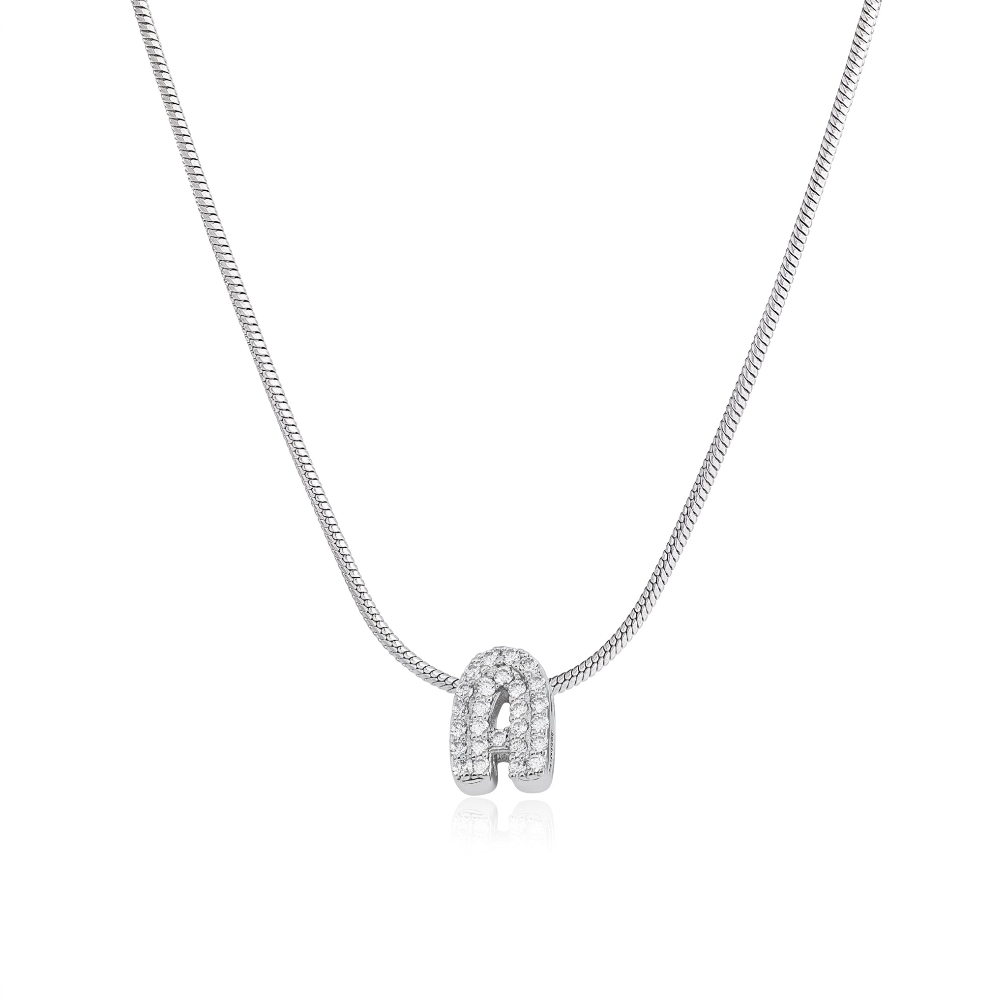 Silver bubble letter necklace on a snake chain, laid on white