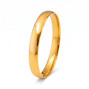 Plain polished gold bangle bracelet on white