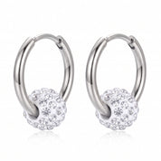 Pair of silver hoop earrings with crystal ball charms on white