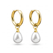 Pair of Odile gold huggie hoops with teardrop pearl drops on white background
