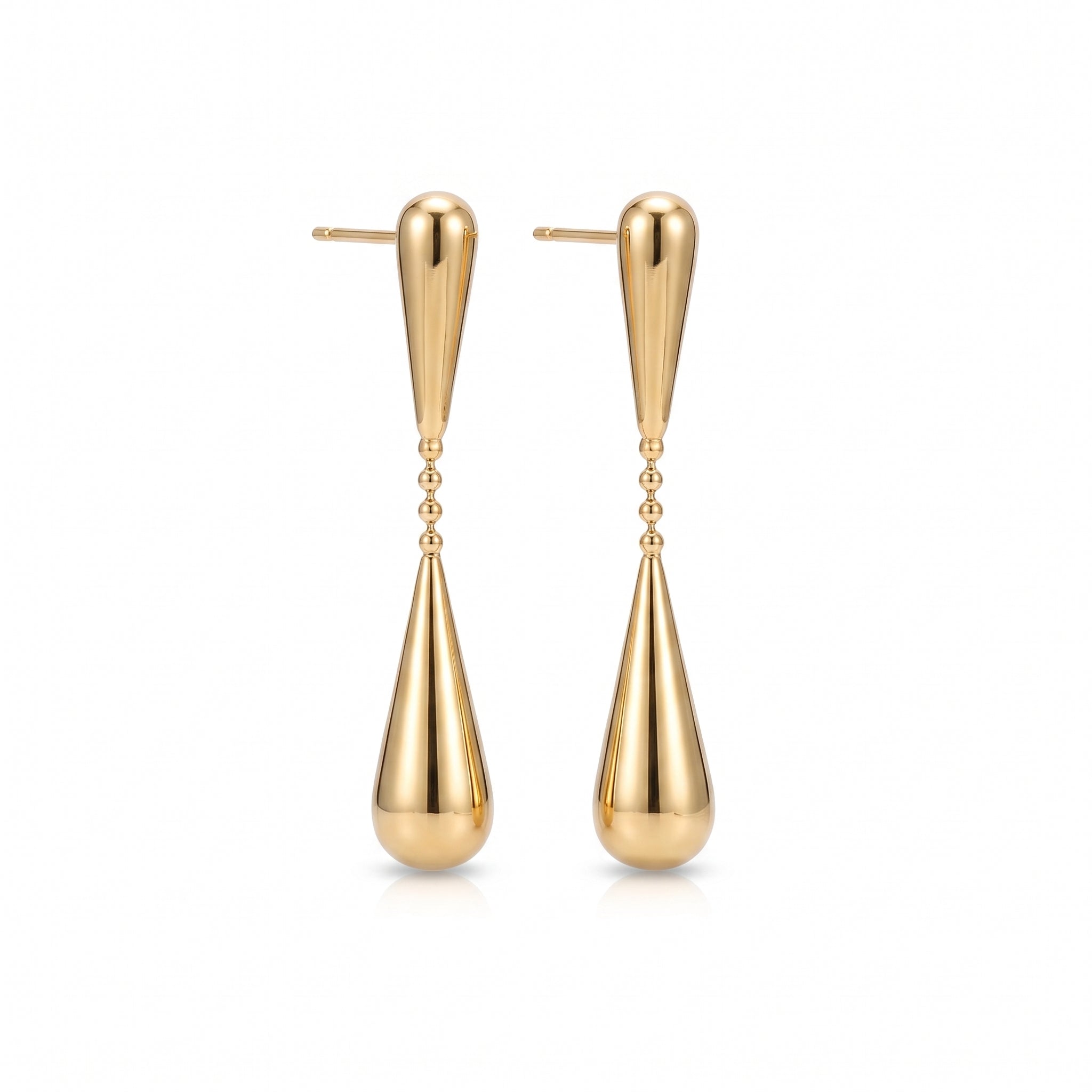Gold teardrop earrings, pair laid out on a white background