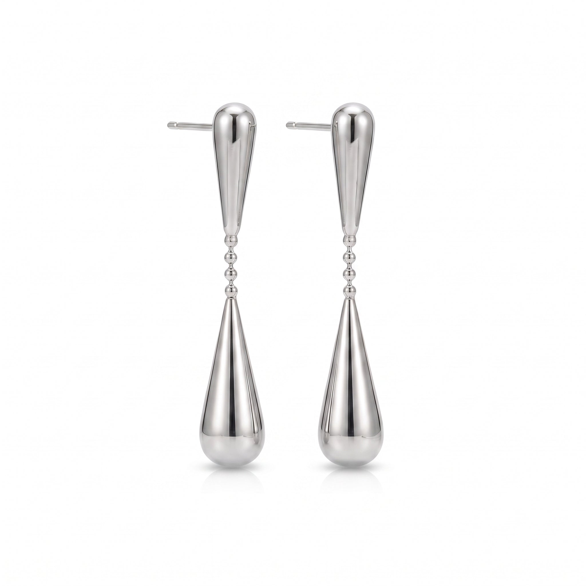 Silver teardrop earrings, pair laid out on a white background