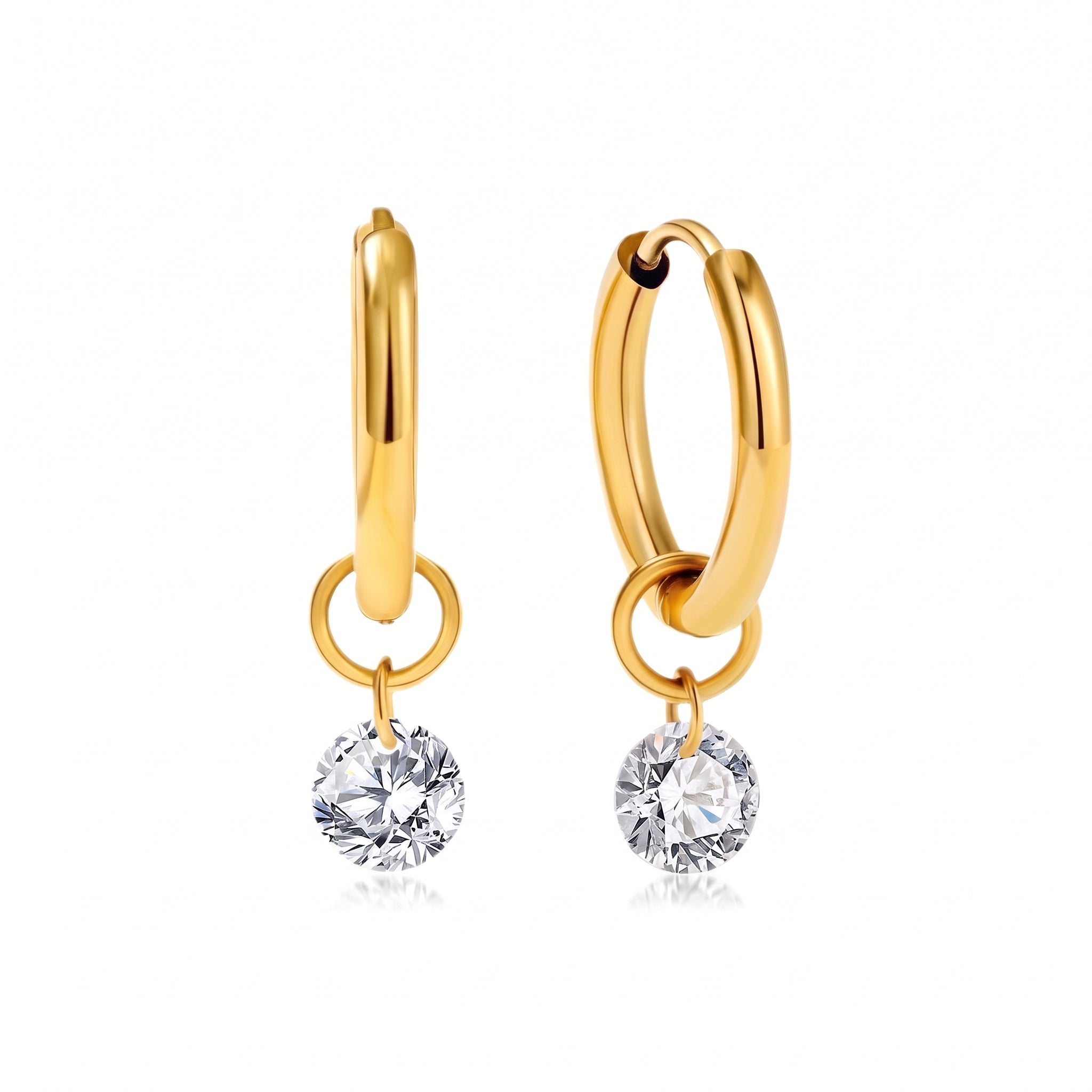 Pair of gold huggie earrings with round crystals on white