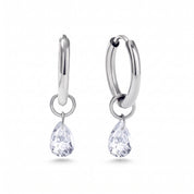 Pair of silver huggie earrings with teardrop crystals on white