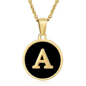 Gold initial disc necklace with letter A on a round black pendant